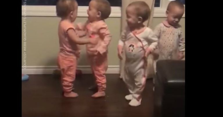 Adorable Quadruplets Sharing Goodnight Hugs and Kisses